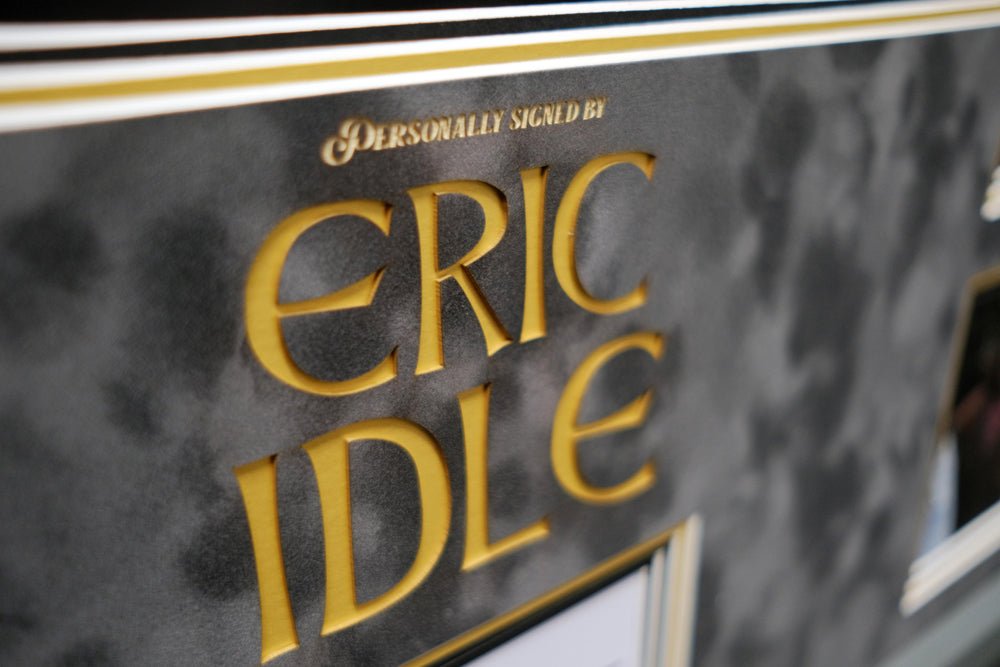 Monty Python Star Eric Idle signed white card display - Memorabilia Framers Shop